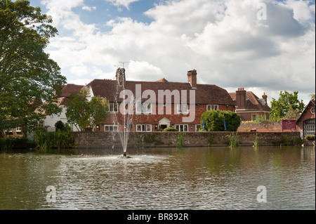 Sunny Goudhurst village pond with fountain in summer Stock Photo