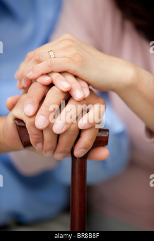 Mature couple stacking hands on top of each other, close up Stock Photo
