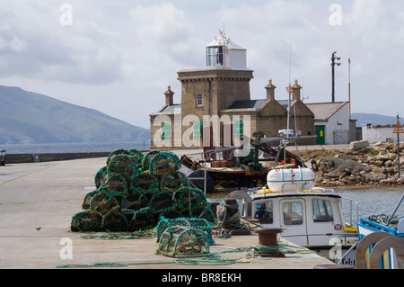 Blacksod pier with blacksod lighthouse in the background, The Erris Peninsula, Co. Mayo, Ireland Stock Photo