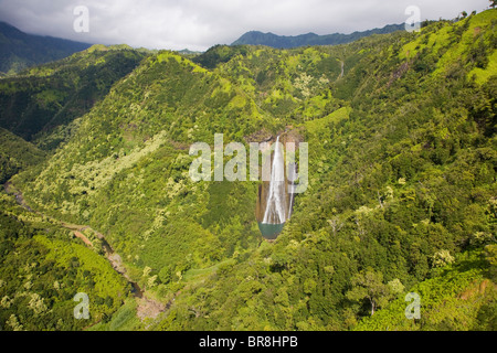 Wailua Falls and mountain ranges Stock Photo