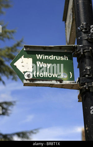 Overhead sign with arrow pointing to the Windrush Way in Bourton-on-the-water in Gloucestershire Stock Photo