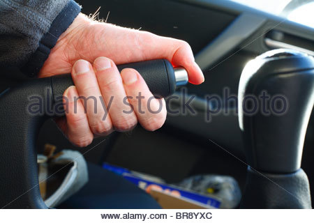 Hand on car handbrake Stock Photo