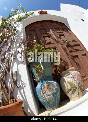 Flower Pots Outside Classic Villa  In Lindos Rhodes Greek Islands Greece Hellas Stock Photo