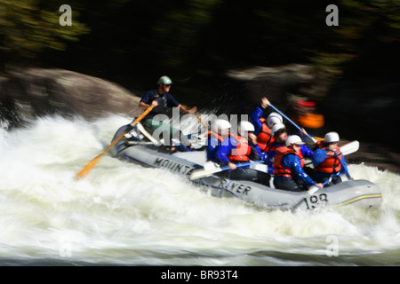 Motion-blur photo of unknown whitewater rafters crashing through Pillow Rock rapid on the Upper Gauley river near Fayetteville Stock Photo
