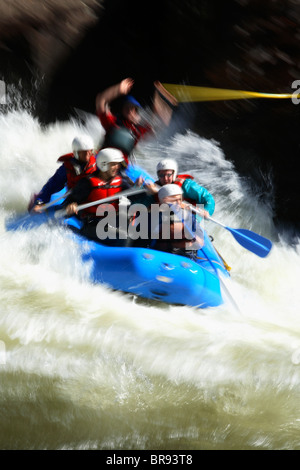 Motion-blur photo of unknown whitewater rafters crashing through Pillow Rock rapid on the Upper Gauley river near Fayetteville Stock Photo