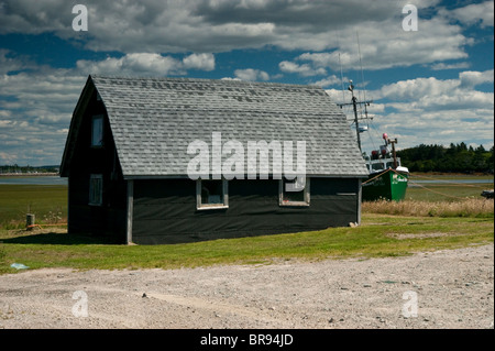 Small house with a dutch barn roof South Shore, Nova Scotia Stock Photo