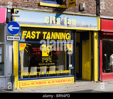 High street tanning salon, Chester, Cheshire, England, UK Stock Photo