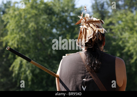 Cherokee, North Carolina - A Cherokee man, member of the Warriors of AniKituhwa group, and his blowgun Stock Photo