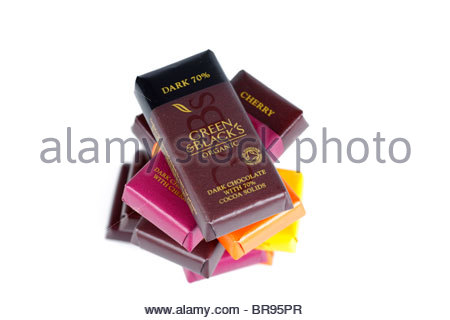 Selection of individually wrapped chocolates with dark chocolate on top Stock Photo