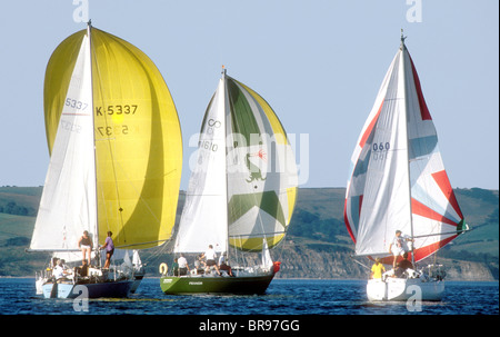 Yachts racing with spinnakers set at Weymouth Dorset England UK Stock Photo