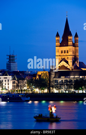 Germany, Nordrhein-Westfalen, Cologne. Evening over the Gross St. Martin church and Frankenwerft Rhein River embankment. Stock Photo