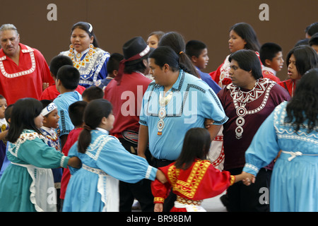 Cherokee, North Carolina -  Chactaw Indians performing a social dance on stage during the annual Southeast Tribes Festival. Stock Photo