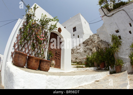 Flower Pots Outside Classic Villa  In Lindos Rhodes Greek Islands Greece Hellas Stock Photo