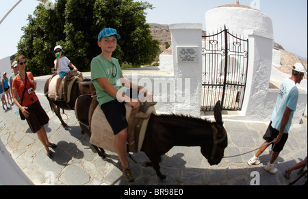 Tourists Riding Donkeys In Lindos Rhodes Greek Islands Greece Hellas Stock Photo