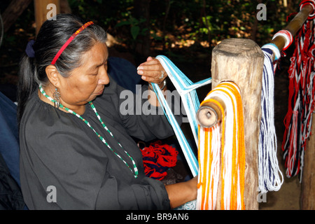 An artisan demonstrates weaving at Oconaluftee Village, Cherokee, North Carolina Stock Photo