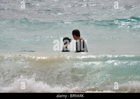 Father and son in sea in Sal Cape Verde Stock Photo