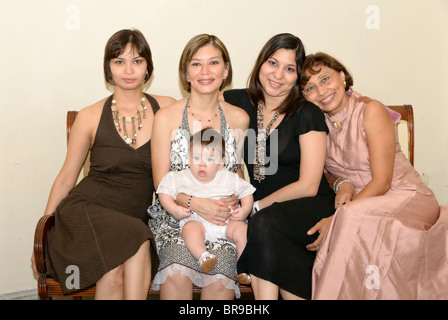 Merida, Yucatan/Mexico-July 8: Baby boy baptism celebration. Family group shot. Mother holding her baby boy Stock Photo