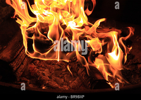 A log burns Stock Photo