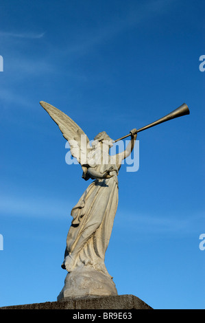 Statue of an angel blowing a trumpet Stock Photo