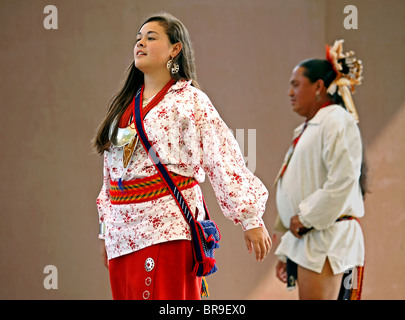 Cherokee, North Carolina -  A Cherokee couple performing a social dance on stage during the annual Southeast Tribes Festival. Stock Photo
