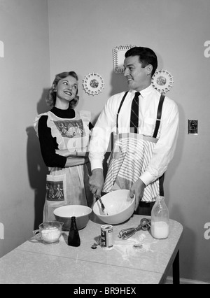 https://l450v.alamy.com/450v/br9hex/1950s-satisfied-amused-smiling-couple-husband-wife-in-kitchen-cooking-br9hex.jpg