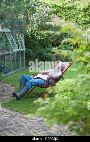 Gardener sleeps on deckchair in back garden