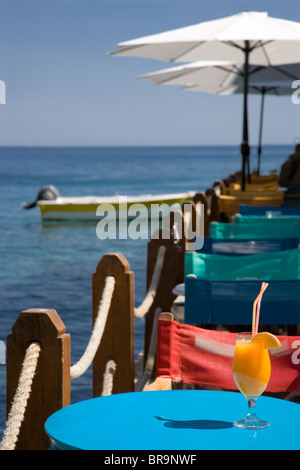 A glass of fresh Orange Juice at a cocktail bar in Loutro South Crete Greece Stock Photo