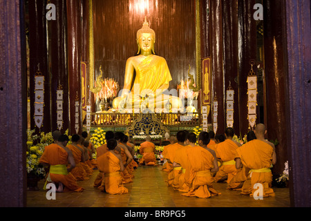 A group of monks during a prayer session Stock Photo