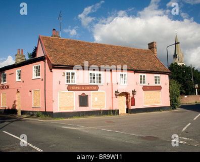 Closed down boarded up village pub, Horse and Groom, Melton, Suffolk, England Stock Photo