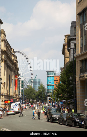 View into Cross Street with wheel and Urbis museum in Manchester UK Stock Photo