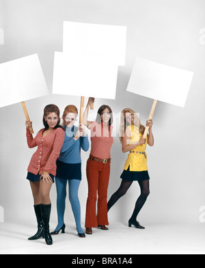 1960s FOUR WOMEN PROTESTERS HOLDING BLANK SIGNS Stock Photo