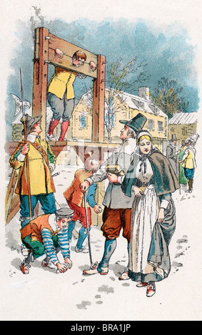 1600s COLONIAL NEW ENGLAND SCENE MAN IN PILLORY BOYS THROWING SNOWBALLS PURITAN COUPLE WALKING WINTER STREET Stock Photo