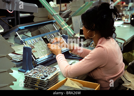 ASSEMBLING COMPUTER WOMAN WORKER Stock Photo