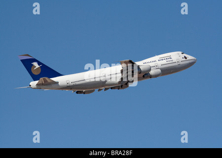 Air travel. Hellenic Imperial Airways Boeing 747-200 flying on departure against a blue sky Stock Photo