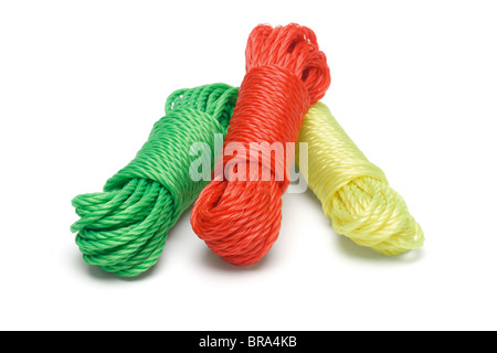 Three bundles of colorful nylon ropes on white background Stock Photo