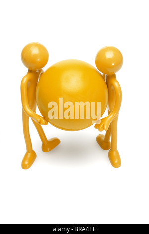 Rubber toy figurines holding large ball on white background Stock Photo