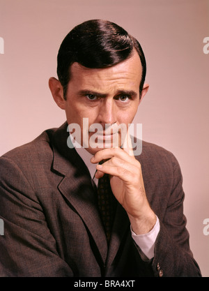 1960s PORTRAIT SERIOUS THOUGHTFUL CONCERNED MAN BUSINESSMAN RETRO Stock Photo