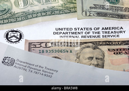 united states internal revenue service letters with dollars cash banknotes correspondence Stock Photo