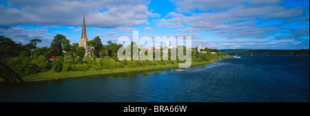 Canada, New Brunswick, Fredericton, City view along Saint John River, Trail bridge in background Stock Photo