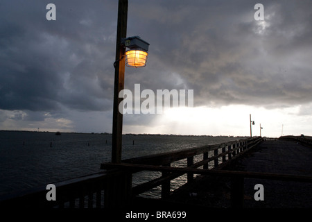 A dramatic  sunset  over the fishing pier at Grand Isle, Louisiana. Stock Photo