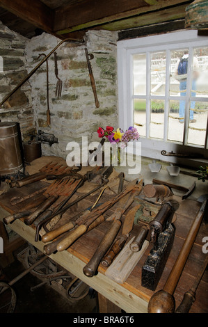 Gardeners workshop with historic gardening tools in the Melon Yard at The Lost Gardens of Heligan in Cornwall England UK Stock Photo