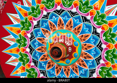 Carretas are elaborately painted oxcarts in the city of Sarchi Norte, Costa Rica. This view is a detail of a wheel. Stock Photo