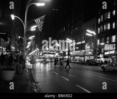 1960s 1963 NIGHT SCENE OF BUSY TRAFFIC ON STATE STREET CHICAGO ILLINOIS Stock Photo