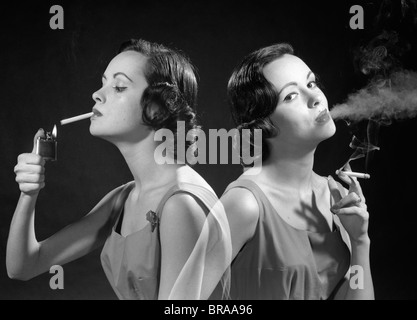 1960s MULTIPLE EXPOSURE TWO VIEWS BRUNETTE WOMAN SMOKING A CIGARETTE LIGHTING IT AND EXHALING SMOKE Stock Photo