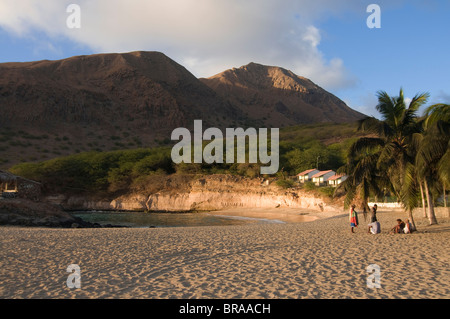 Young men in the afternoon on sandy beach of Tarrafal, Santiago, Cape Verde Islands, Atlantic, Africa Stock Photo