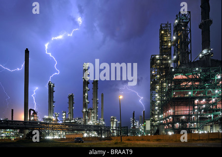 Lightning during thunderstorm above petrochemical industry in the Antwerp harbour, Belgium Stock Photo