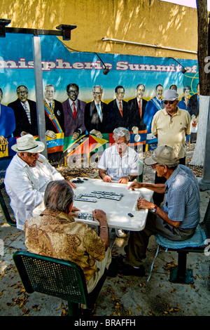 Retired local men playing dominoes in Little Havana Miami  Stock Photo