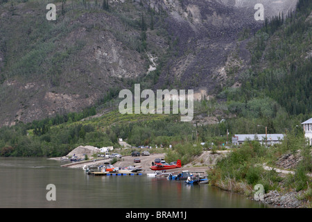 Boats and airplanes on the Yukon River near Dawson city, Yuk9on, Canada Stock Photo