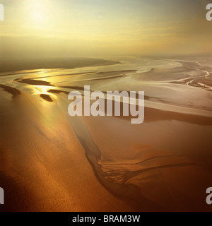 Aerial image of mudflats at sunset, Solway Firth, border between Cumbria in England and Dumfries and Galloway in Scotland, UK Stock Photo