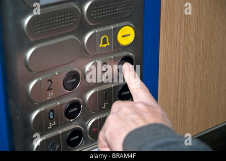 Pressing Lift Button Stock Photo